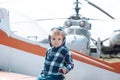 Its time to fly. Little kid have summer vacation. Cute boy child on vacation trip. Little child at helicopter field Royalty Free Stock Photo