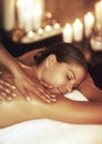 Its time to relax. a young woman enjoying a back massage. Royalty Free Stock Photo