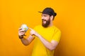 Its time to save the world. Photo of young bearded hipster man pointing at globe Royalty Free Stock Photo