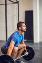 Its tough, but it works. a handsome young man lifting weights while working out in the gym. Royalty Free Stock Photo