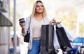Its a wonderful day for some retail therapy. a beautiful young woman enjoying a day of shopping. Royalty Free Stock Photo