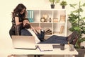 Its a workplace affair. Business professionals dating at workplace. Workplace romance of bearded man and sexy woman in