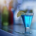 Its your party companion. a glass of alcohol on a countertop in a nightclub. Royalty Free Stock Photo