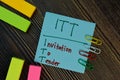 ITT - Invitation To Tender write on sticky notes isolated on Wooden Table Royalty Free Stock Photo