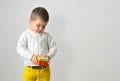 Ittle boy is holding a Christmas gift box Royalty Free Stock Photo