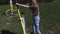 Ittle girl doing physical activities on stepping machine at outdoor