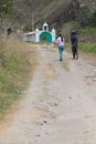 Villagers go to the small church