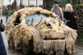 Tractor drawn by a tractor and transporting women dressed as sevillanas in the rural carnival parade.