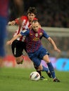 Iturraspe(L) vies with Iniesta(R) of Barcelona