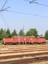 View of red locomotive and multiple train tracks from platform at Itzehoe train station Royalty Free Stock Photo