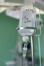 IV bag hanging on a metal pole in the operation room