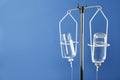 IV infusion set on blue background. Space for text Royalty Free Stock Photo