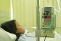 IV machine with patient in background Royalty Free Stock Photo