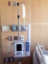 IV pole containing antibiotics in hospital room