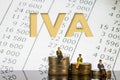 IVA Value Added Tax on Piles of Gold Coins with a White Background