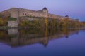 Ivangorod fortress in lilac October twilight. Leningrad region Royalty Free Stock Photo