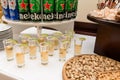 Ivano-Frankivsk, September 8, 2023: beer of various brands stacked in a pyramidand cognac in glasses.