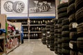 Ivano-Frankivsk, Ukraine, August 26 2019: Car tires and wheels at warehouse in tire store