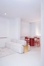 Ivano-Frankivsk, Ukraine, 08.07.2021. Chic design of a large bright living room kitchen with a white sofa with a stand