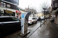 Ivano-Frankivsk, Ukraine - March, 2023: Parking machine in rainy city street
