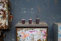 Three empty plastic cups of coffee drinks on the street.