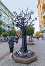 Ivano-Frankivsk, Ukraine - October 17, 2015: Child rides a forged metal Tree of happiness