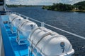 Ivanovo region, Russia, July 3, 2023. Life rafts on the deck of the ship against the background of the river. Royalty Free Stock Photo