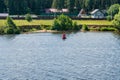 Ivanovo region, Russia, July 3, 2023. Navigation buoy on the river near a small village. Royalty Free Stock Photo