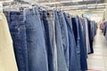 Ivanovo, Russia, June 9, 2021, Row of hanged blue and black jeans in a shop