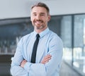 Ive become much more confident over the years. Portrait of a mature businessman standing with his arms crossed in an Royalty Free Stock Photo