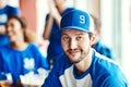 Ive always been a diehard blue supporter. Portrait of a man watching a sports game with friends at a bar.