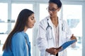 Ive been feeling a little low. a young woman having a consultation with her doctor.