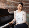Ive been playing forever. Portrait of a pianist sitting at her piano. Royalty Free Stock Photo