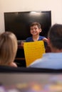 Ive finished my chores. a little boy showing his parents a chore list at home.