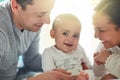 Ive got the best Mommy and Daddy ever. an adorable baby boy bonding with his father and father at home. Royalty Free Stock Photo