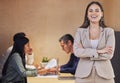 Ive got the best team behind me. Cropped portrait of an attractive young businesswoman standing with her arms crossed in Royalty Free Stock Photo