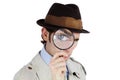 Ive got my eye on you. Curious private investigator looking through a magnifying glass against a white background. Royalty Free Stock Photo