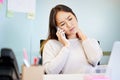 Ive got such a stiff neck. an attractive young businesswoman sitting alone in the office and suffering from neck pain Royalty Free Stock Photo