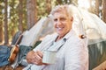 Ive always loved camping. Cropped portrait of a handsome mature man drinking coffee at his campsite in the woods. Royalty Free Stock Photo