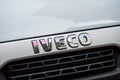 Iveco logo on front truck parked in the street