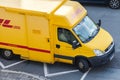 Iveco transporter from international courier, parcel, and express mail company DHL, stands on a