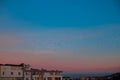 Iving building rooftop flying birds evening beautiful urban scene with sunset blue purple colorful sky background scenic