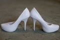 Ivory female wedding footwear over white background