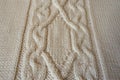 Ivory handmade knitted fabric with plait pattern