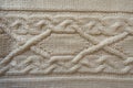 Ivory handmade knitwork with horizontal plait pattern