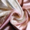 Ivory  and pink  Soft Silky Shiny Stretch Charmeuse Satin Fabric Royalty Free Stock Photo
