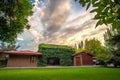 Ivy covered house and colorful sky Royalty Free Stock Photo