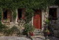 Ivy-covered old stone house in the well preserved medieval Old town Kotor, Montenegro