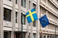 Ixelles, Brussels Capital Region, Belgium - Swedish and European union Flag at the Swedish embassy facade Royalty Free Stock Photo