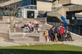 Ixelles, Brussels Capital Region - Belgium - Young mixed group of students having a lunch break at the stairs of the sports